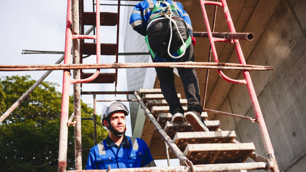 istock Engineers walking up the staircase in a building site. 2197523845