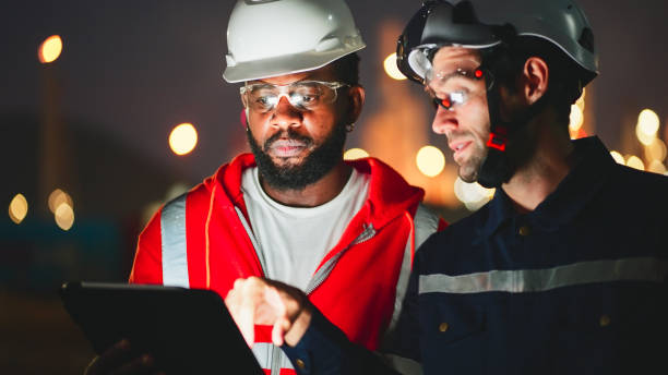 istock Engineer use digital tablet to expertise petroleum industrial factory at night. 2197523896
