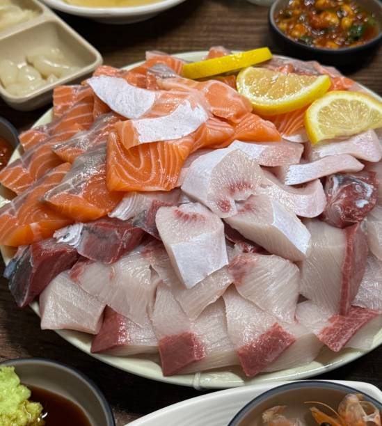 istock Sashimi, a Japanese delicacy featuring thinly sliced raw fish, served fresh and beautifully arranged for a pure and flavorful experience. 2197528682