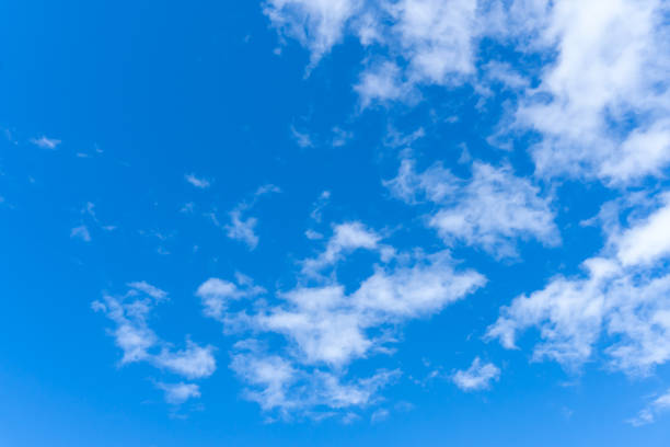 istock Low angle view and full frame of beautiful blue sky with strange shape of fluffy white clouds in the morning or evening on sunny day used as natural background texture in decorative art work 2197528871