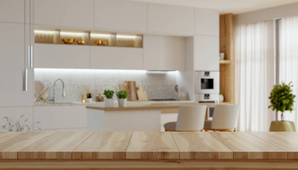 istock Kitchen with a counter and cabinets,Empty wooden table with the bright white interior- 3D rendering 2197529253