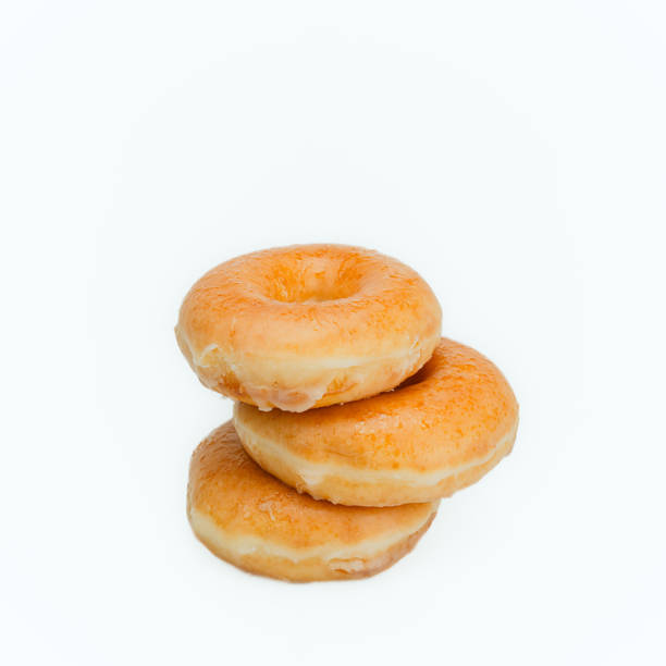 istock Trio of Classic Glazed Donuts 2197530029