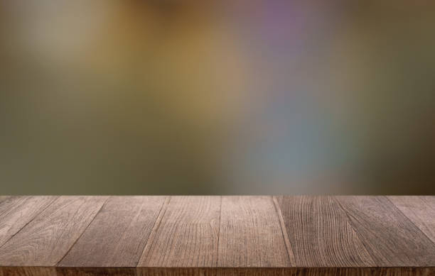 istock Empty wood table top and blur of restaurant background selective focus product display 2197530800