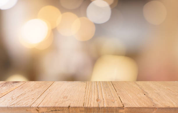 istock Empty wood table top and blur of restaurant background selective focus product display 2197530802