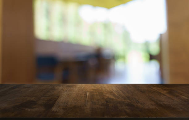 istock Empty wood table top and blur of restaurant background selective focus product display 2197530805