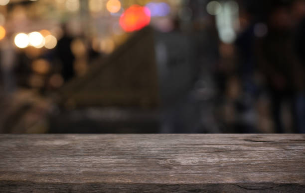 istock Empty wood table top and blur of restaurant background selective focus product display 2197530810
