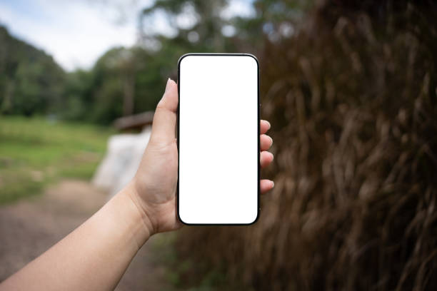 istock Smart phone mockup. Women hands holding cell telephone blank copy space screen smartphone blank white screen isolated technology concept. 2197530845