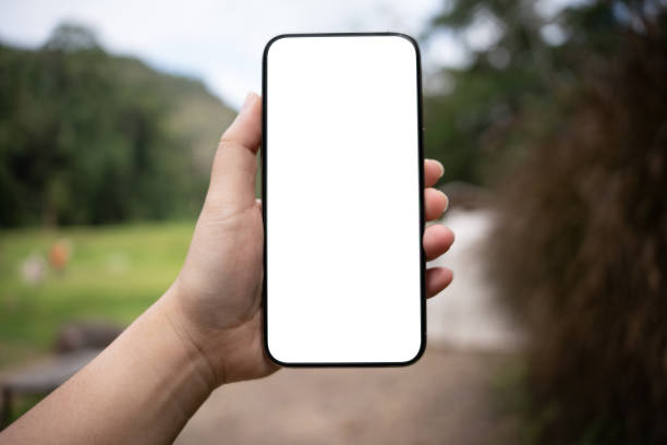 istock Smart phone mockup. Women hands holding cell telephone blank copy space screen smartphone blank white screen isolated technology concept. 2197532993