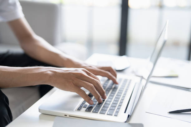 istock Business man working using laptop computer Hands typing keyboard. Professional investor working start up project. business planning in office. Technology business Concept 2197533094