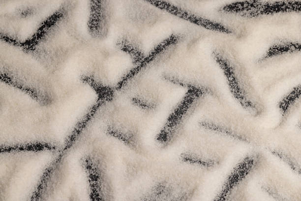istock close-up of white granulated sugar on black slate 2197533427