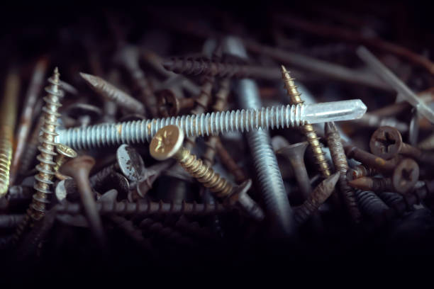 istock Mails and screws on the dark background, closeup view. 2197535250