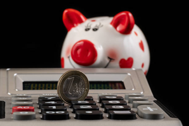 1 ero coin and calculator on black background