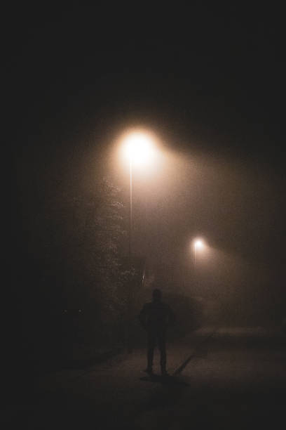istock Man in the dark and misty winter morning 2197538812