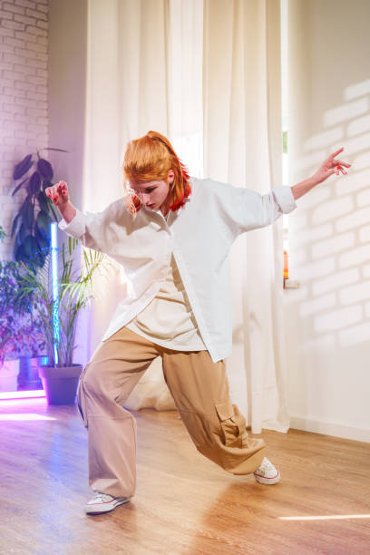 istock Dancer expressing creativity in a bright studio with natural light during a rehearsal session 2197539355