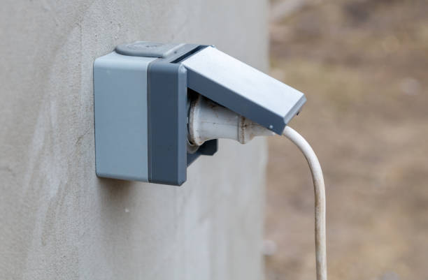 istock A grey box with a white plug sticking out of it 2197541896
