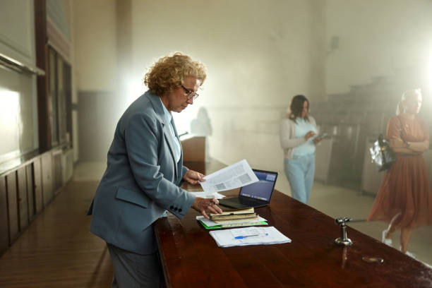 istock Female professor preparing before a class in amphitheater. 2197546053