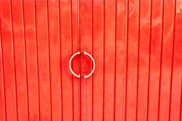 istock Red Metal Door with Circular Handles 2197546239