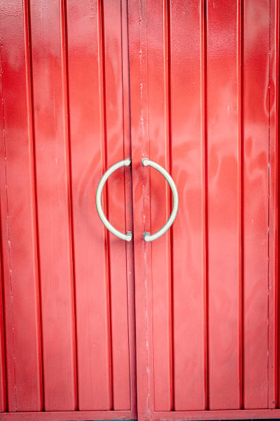 istock Red Metal Door with Circular Handles 2197546243