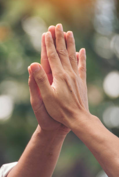 istock Vertical Horizon Group of teamwork high five team together hands raise up power partner. Diversity multiethnic business people hands success team together. Vertical Collaborate Volunteer partner win 2197548279