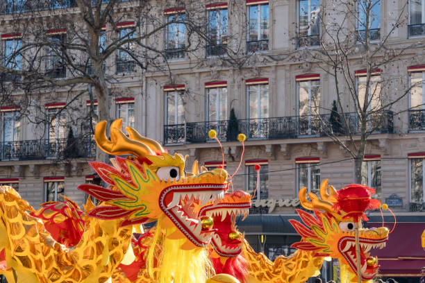Paris,France-02.02.2025 A vibrant dragon dance dazzles the Champs-Elysees for Chinese New Year 2025, filled with color and lively performances in a festive atmosphere.