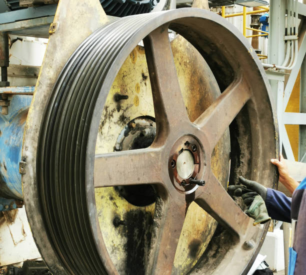 Mechanical technician installation big V-belt pulley for agitator water& pulp after change electric motor onsite