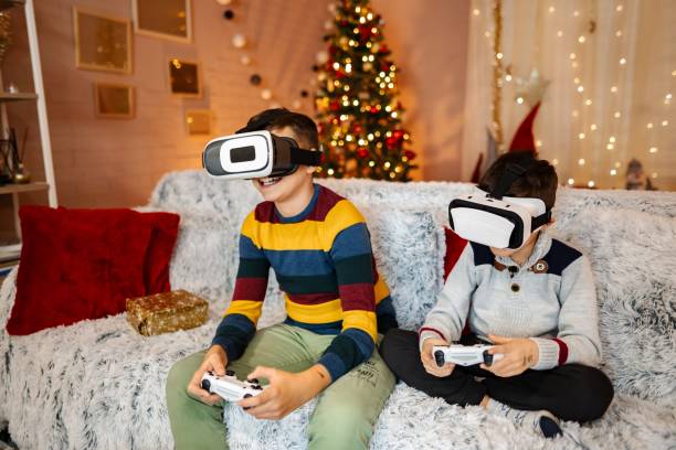 istock Two brothers playing vr video games at christmas time 2197556066