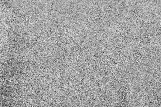 istock Gray suede. Texture of suede leather dyed gray as a background. 2197556096