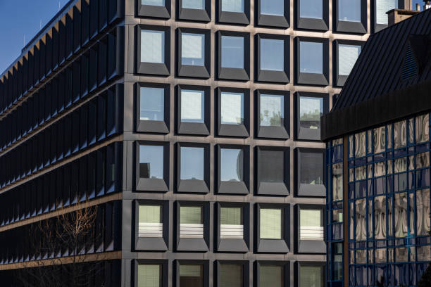 istock Modern building facade with large glass windows. Business office background 2197556582