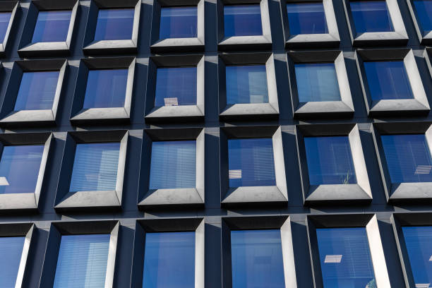 istock Modern building facade with large glass windows. Business office background 2197556610