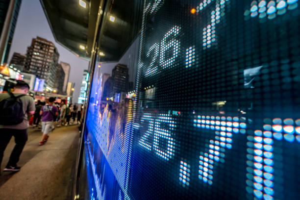 istock Illuminated Stock Exchange Data Displayed on Urban Digital Screen in Night Setting 2197556795