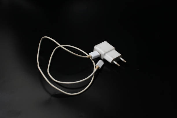istock white smartphone charger on a black background 2197557277