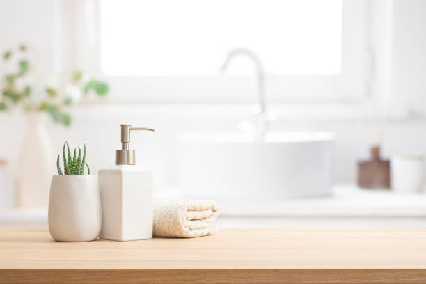 istock Elegant hygiene composition on wooden table with copy space in blurred bathroom interior 2197557799