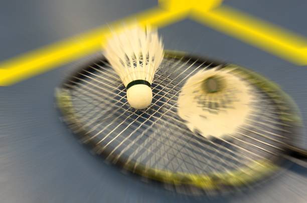 istock Shuttlecocks and badminton rackets on blue background. Top view 2197557816