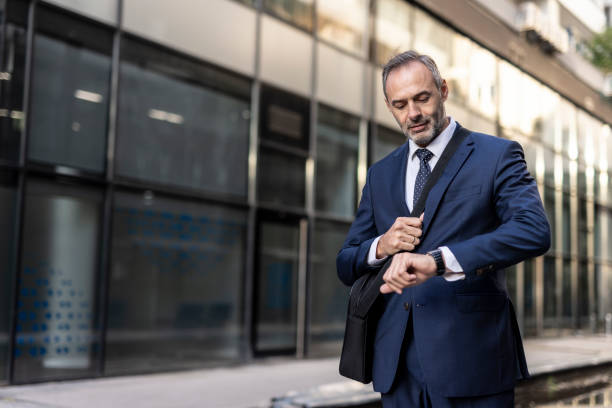 Businessman wearing a suit while standing outdoors.