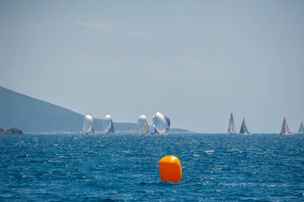 Sailing yachts with spinnaker at regatta