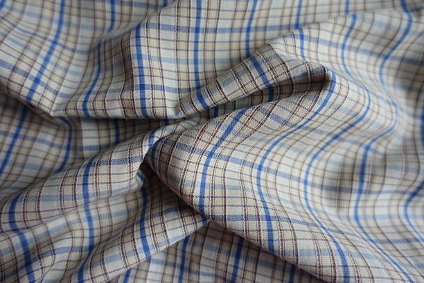 istock blue, white and brown checkered cotton fabric in soft folds 2197560624