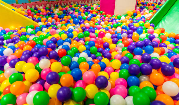 istock Colorful ball pit and green slide inviting kids for endless fun 2197562598