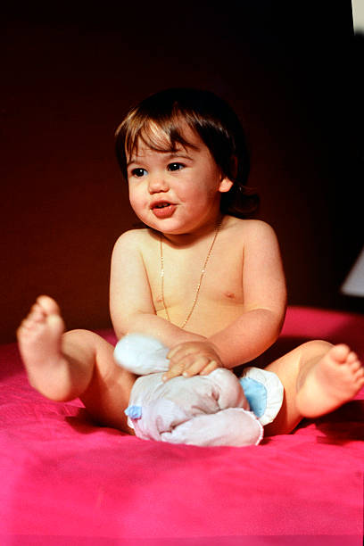 istock baby girl with her blanket 2197564740