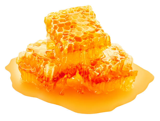 istock Honeycomb with flowing honey syrup isolated on white background. Honey Flat lay. Top view.  Package design element 2197565623