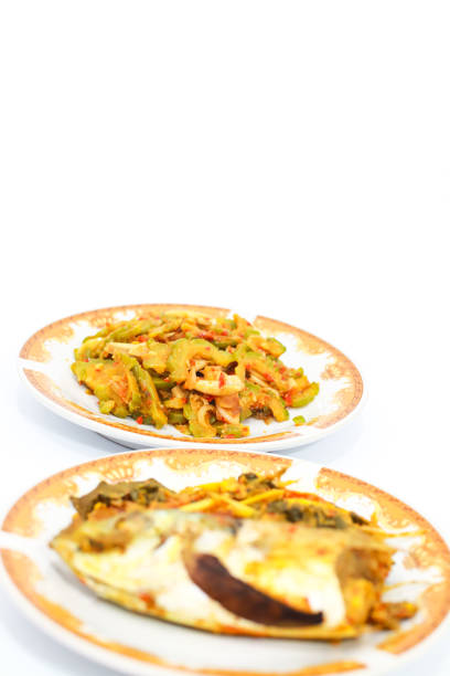 istock Steamed Fish with Stir Fried Bitter Melon on Plates 2197565754