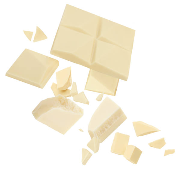istock White Chocolate explosion. Levitating milk chocolate pieces shattering isolated on white background. Falling  Chocolate chunks, shavings and cocoa crumbs 2197565889
