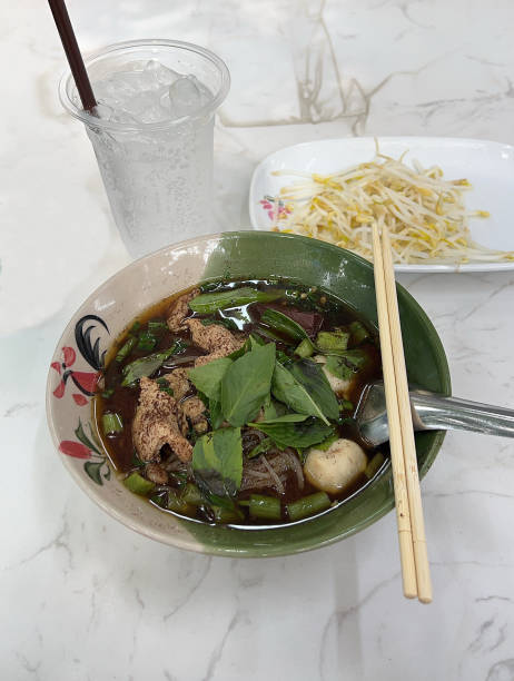istock Thai rice noodles with spicy pork broth 2197566293