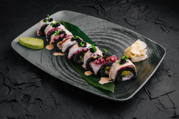 istock Delicious sushi rolls with fresh ingredients served on a stylish plate 2197567210