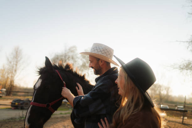 istock Couple enjoing at their horse racnh 2197568310