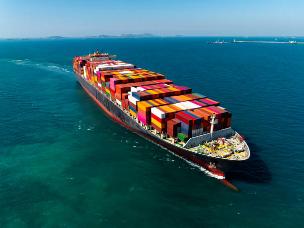 istock cargo logistic container ship sailing in sea, import export goods and distributing products to dealer and consumers across worldwide, container shiping service  concept. 2197569398
