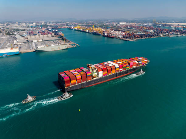 istock aerial view cargo logistic container ship sailing in sea, import export goods and distributing products to dealer and consumers across worldwide, 2197569415