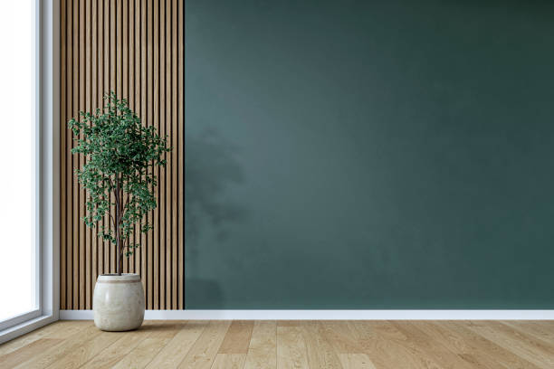 istock A retro-modern minimalist unfurnished interior with a potted plant by a large window, in front of an empty, deep green (castleton) plaster, partly  hardwood paneled wall background with copy space 2197572190
