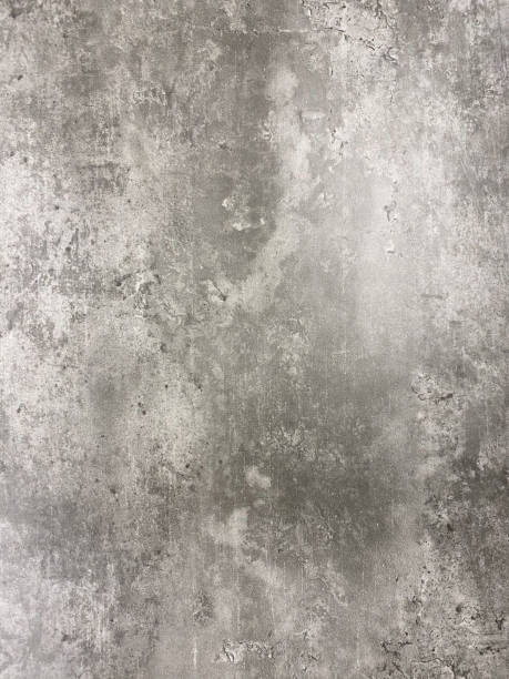 Close-up of a gray concrete texture with natural patterns, rough surface, and subtle variations in tone