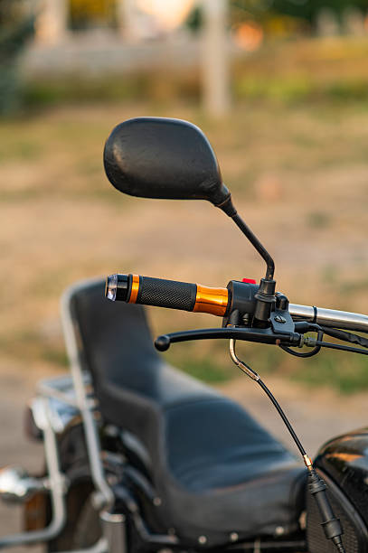 istock throttle handle and the mirror on the handlebars of the motorcycle. close-up 2197575419