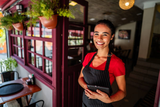 istock Portrait of a waitress using digital tablet in a restaurant 2197576466